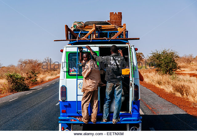 fully-loaded-van-driving-down-a-road-through-the-savannah-mali-eetnxm.jpg