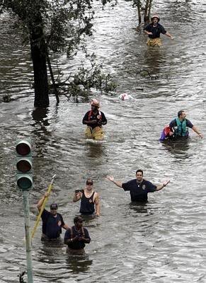 NewOrleansfirefighterswadethroughfl.jpg